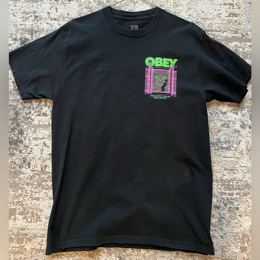 Obey Black T shirt, words front of the shirt, breaking chains worldwide